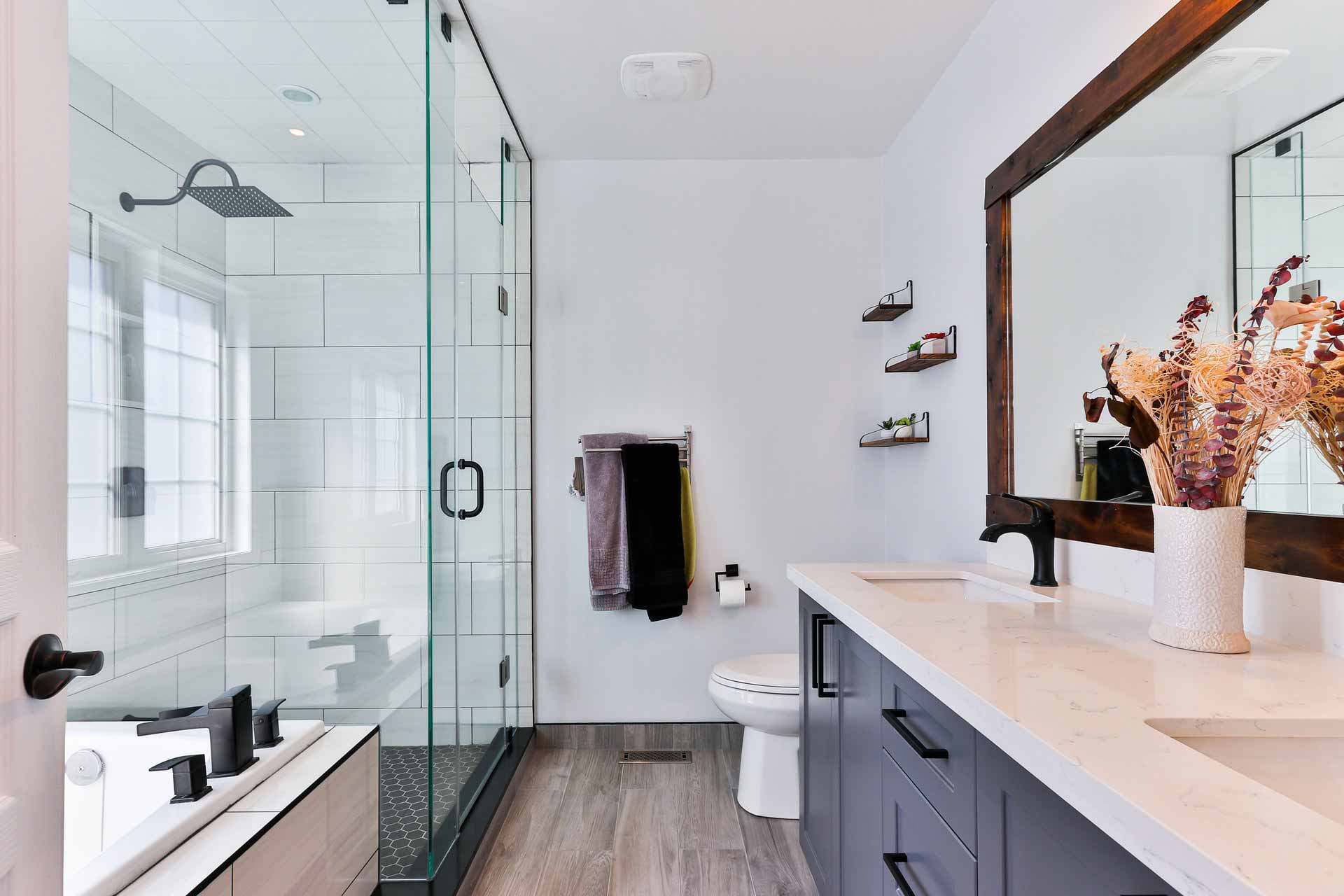 A newly renovated bathroom with dark wood accents